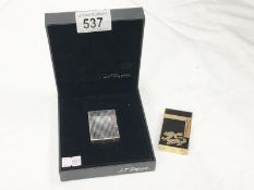 A Dupont lighter in Dupont Paris box & a black & gold coloured Dupont lighter with dragon design