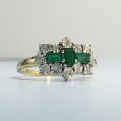 A 9ct gold ring set emeralds and diamonds, size M.