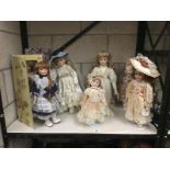 7 collectable dolls in Victorian dress
