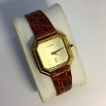 A boxed Cartier octagonal wrist watch on leather strap, in working order.