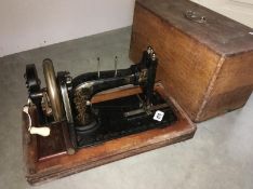 A wood cased sewing machine