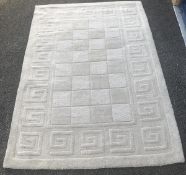 A light beige patterned rug (47"x70")