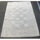 A light beige patterned rug (47"x70")