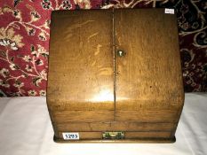 An oak stationery box.