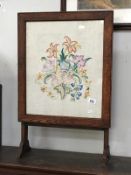 A framed & galzed floral embroidery fire screen