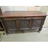 An 18th century carved oak coffer, a/f.
