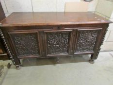 An 18th century carved oak coffer, a/f.