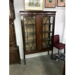 An astragal glazed mahogany display cabinet.