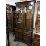 A glazed top book case.