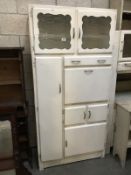 A 1950's/1960's white painted kitchen cabinet