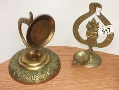 An ornamental candle holder wall bracket & an Indian oil lamp stand