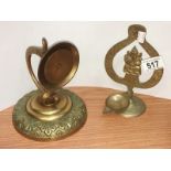 An ornamental candle holder wall bracket & an Indian oil lamp stand