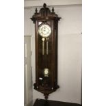 A mahogany double weight wall clock.