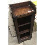 An early 19th century oak bookcase (glass missing).