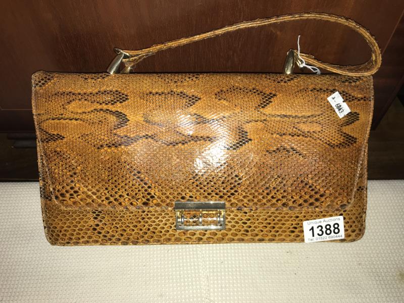 A snakeskin bag and purse.