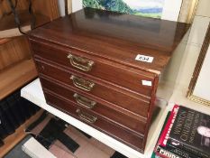 A 4 drawer filing cabinet by Henry Stone & Sons of Banbury