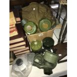 A modern gas mask with 5 filter canisters and military equipment bags and accessories.