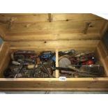 A large wooden tool box (approximately 32" x 14" x 10") with vintage tools.