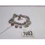 A continental silver bracelet (large link belcher) with 19 enamel town shield crests,