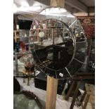 A circular bevelled mirror.