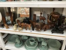 A quantity of carved wooden animals etc.