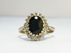 A 9ct gold ring set with sapphire stone & pave diamonds