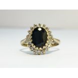 A 9ct gold ring set with sapphire stone & pave diamonds