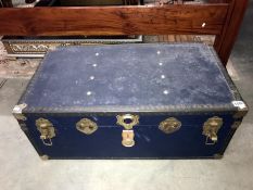 A large cabin trunk with sheet music.