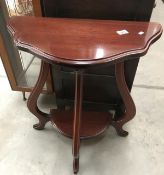 A dark wood stained wall/hall table