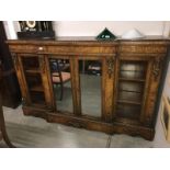 An ormolu mounted credenza.