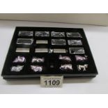 A boxed set of 8 miniature white metal miniature animals on bases by Troika, Germany.