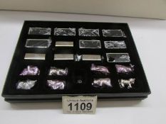A boxed set of 8 miniature white metal miniature animals on bases by Troika, Germany.