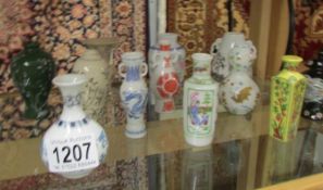 12 miniature Japanese porcelain vases.