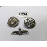 A silver R.A.F brooch and 2 other silver brooches.