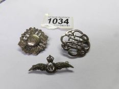 A silver R.A.F brooch and 2 other silver brooches.