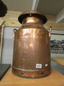 A copper milk churn.