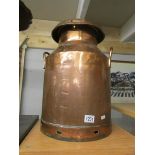 A copper milk churn.