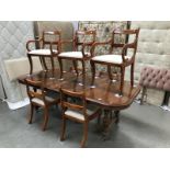 A good quality extending mahogany dining table with 2 leaves & 7 chairs