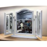 A white three part dressing table mirror