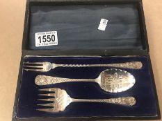 A cased silver plate pickle fork, serving fork and spoon,.