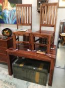 An Indian teak table and 4 chairs