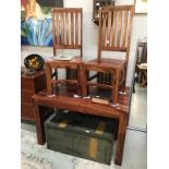 An Indian teak table and 4 chairs