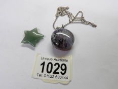 An adventurine quartz star pendant and an art glass fob pendant on chain.