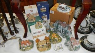 A quantity of Lilliput Lane cottages (some boxed) & Danbury Mint items including Toad Hall by Simon