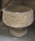 A fleur de lis urn depicting stylised 3 petal design