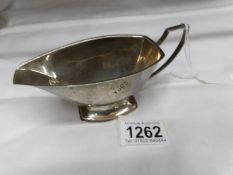 A silver sauce boat (97 grams).