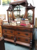 An ornate carved wood sideboard with 6 drawers,