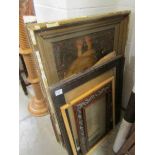 A quantity of old picture frames.