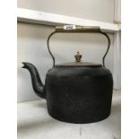 A Victorian cast iron range kettle with brass lid & handle