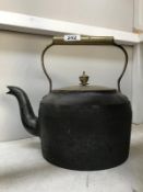 A Victorian cast iron range kettle with brass lid & handle